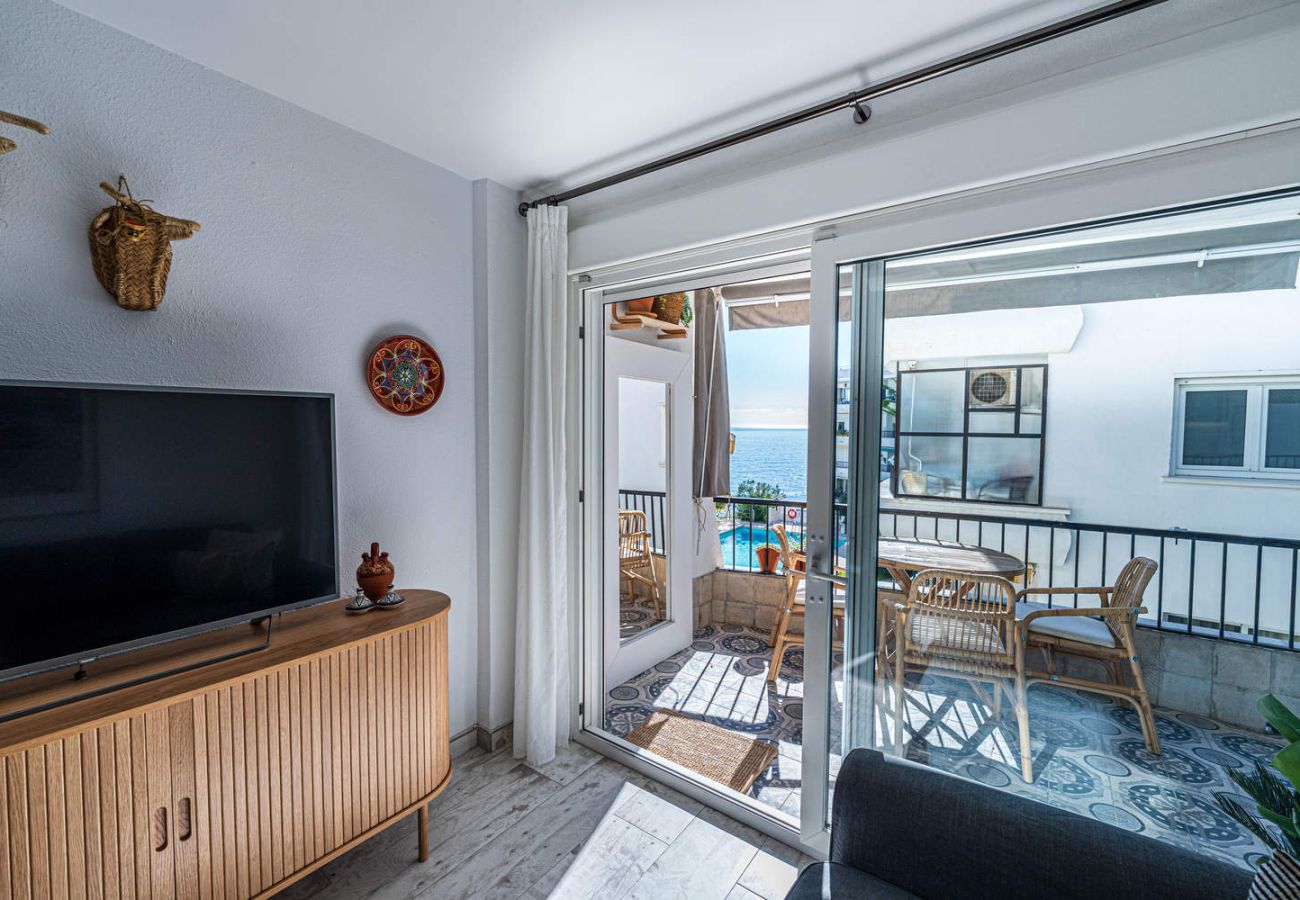 Salon avec canapé et télévision à Acapulco Playa 302